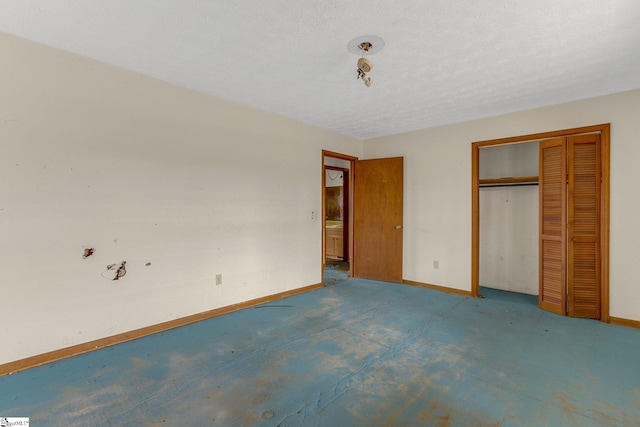 unfurnished bedroom featuring a closet and a textured ceiling