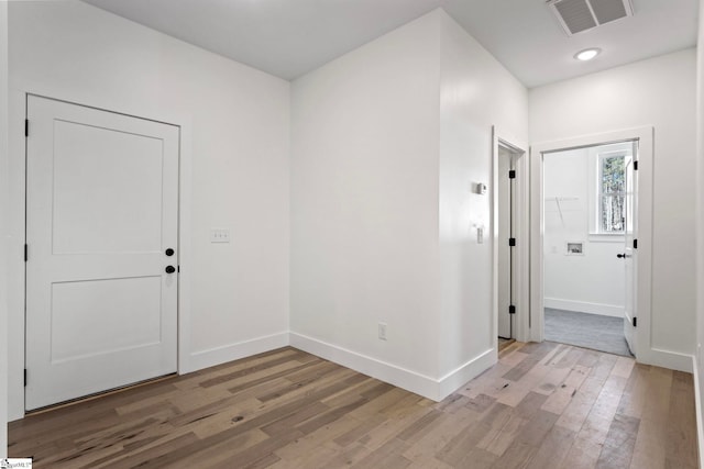 unfurnished room featuring light hardwood / wood-style floors