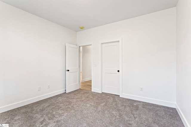 unfurnished bedroom with carpet