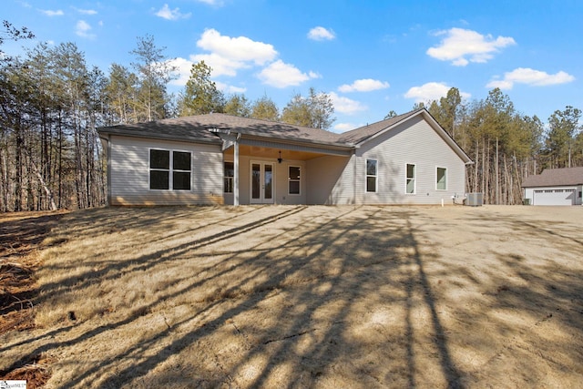 view of front facade with central AC and french doors