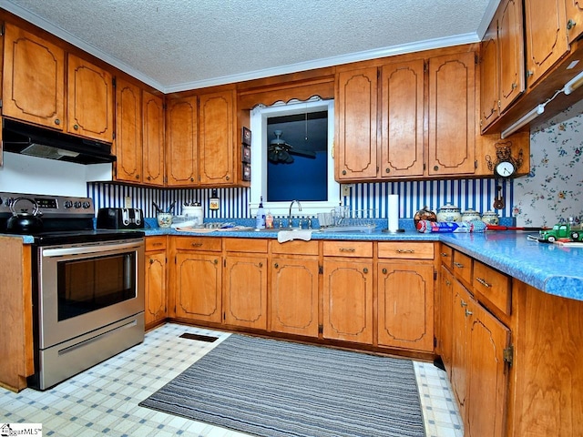 kitchen with light tile floors, a textured ceiling, and stainless steel electric range