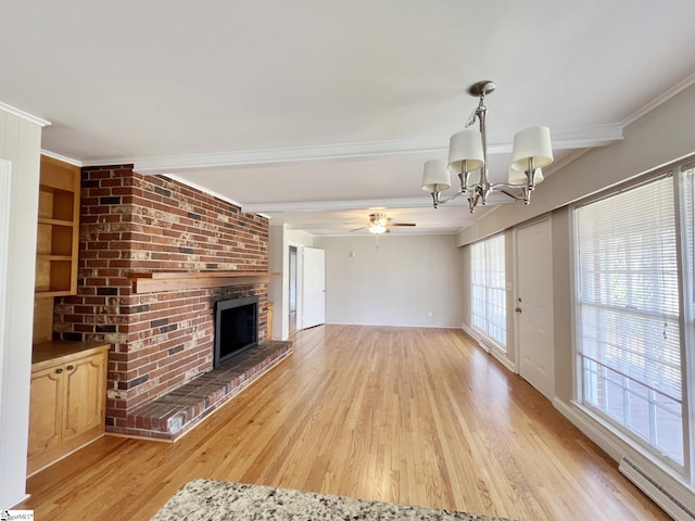 unfurnished living room with crown molding, baseboard heating, a fireplace, and light wood-type flooring