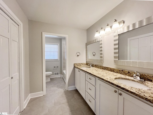 full bathroom with tile flooring, double vanity, shower / washtub combination, and toilet