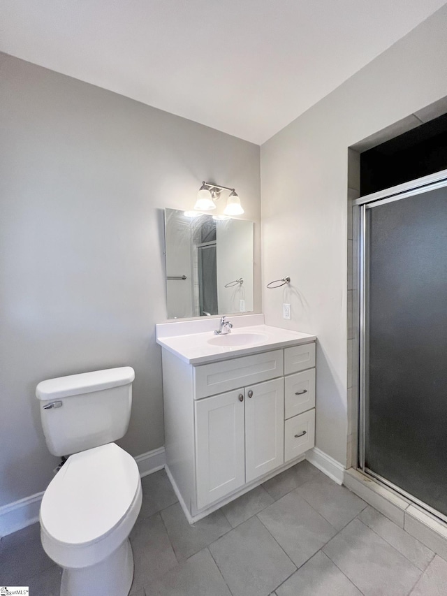 bathroom with walk in shower, vanity, tile floors, and toilet