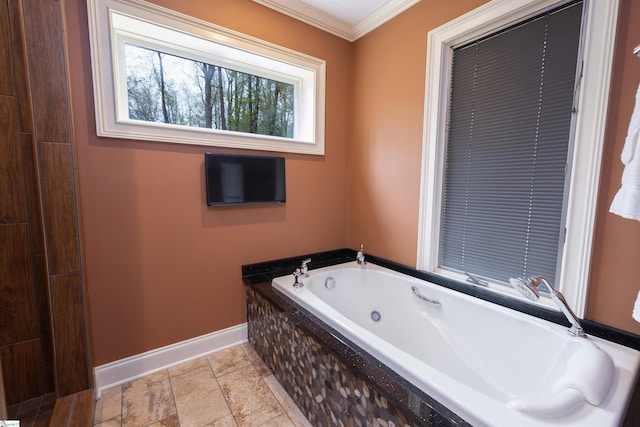 bathroom featuring ornamental molding and a relaxing tiled tub