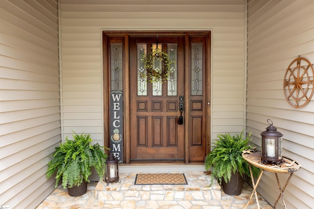 doorway to property featuring a porch