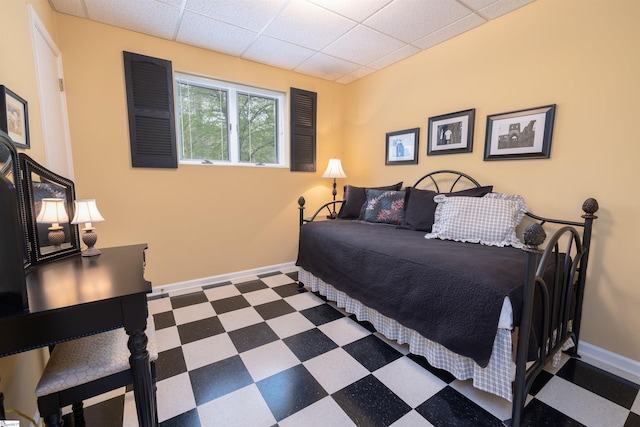 bedroom featuring a paneled ceiling