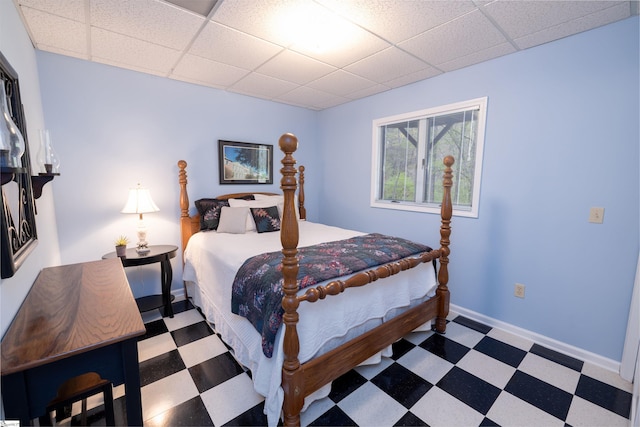 bedroom with a paneled ceiling