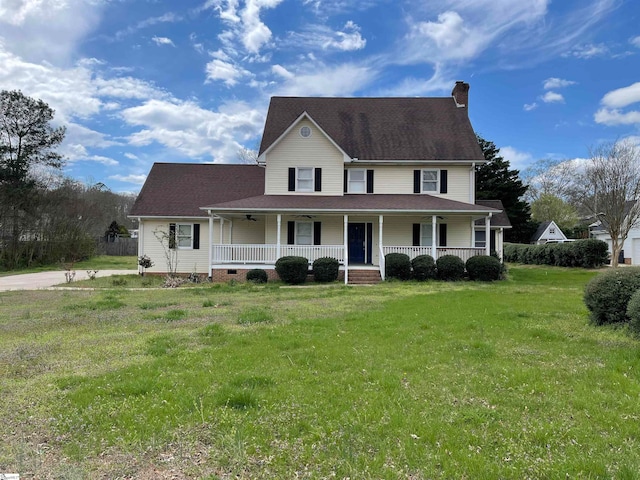 view of front of home featuring a front lawn and covered porch