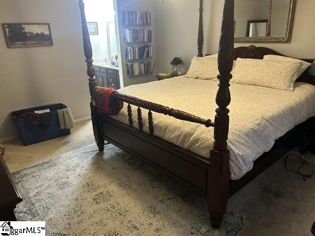 bedroom featuring dark carpet