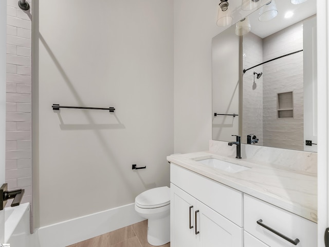 full bathroom with vanity, toilet, and tiled shower / bath combo