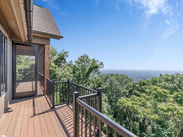 wooden deck with a water view