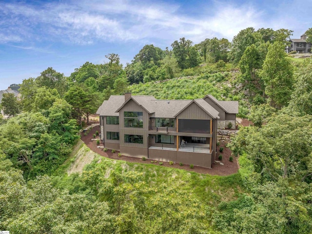 back of property with a balcony