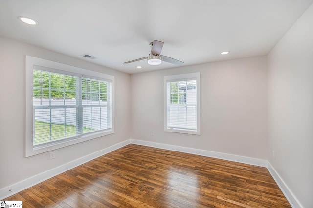 empty room featuring ceiling fan and hardwood / wood-style flooring