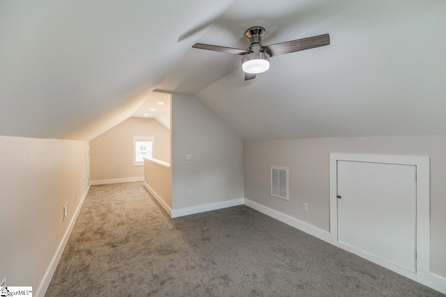 bonus room with vaulted ceiling, ceiling fan, and carpet flooring