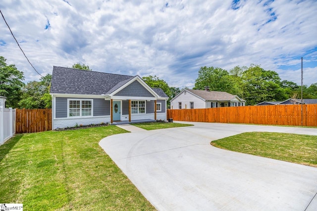 ranch-style home with a front lawn