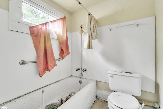 bathroom with toilet and shower / bath combo with shower curtain