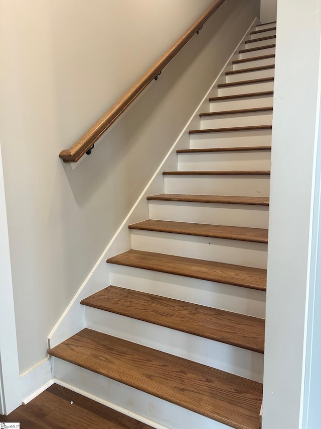 stairway featuring hardwood / wood-style flooring