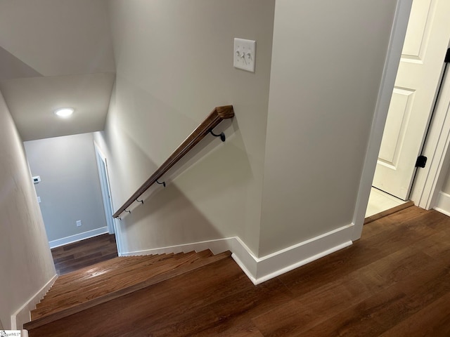 stairs featuring hardwood / wood-style floors