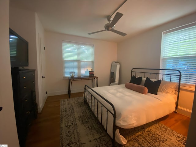 bedroom featuring ceiling fan and hardwood / wood-style flooring