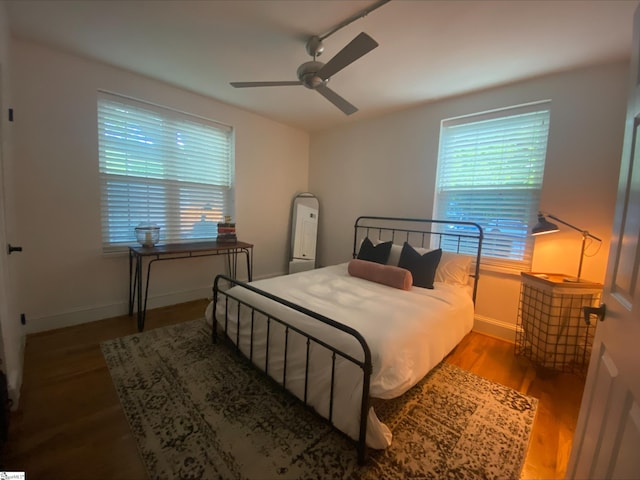 bedroom featuring hardwood / wood-style floors and ceiling fan