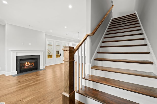 stairs with hardwood / wood-style floors