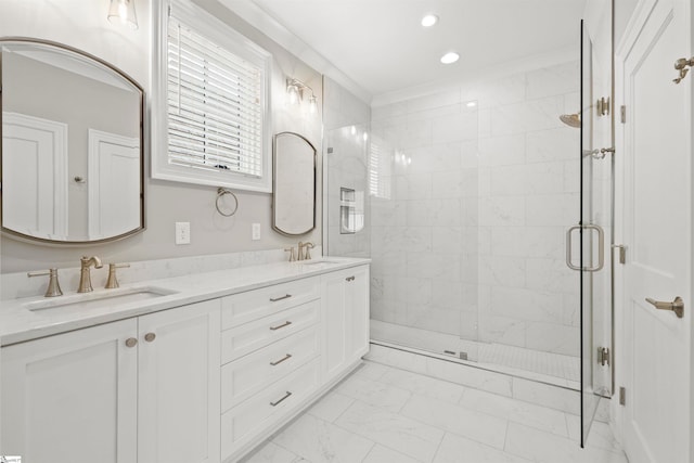 bathroom with crown molding, vanity, and a shower with shower door