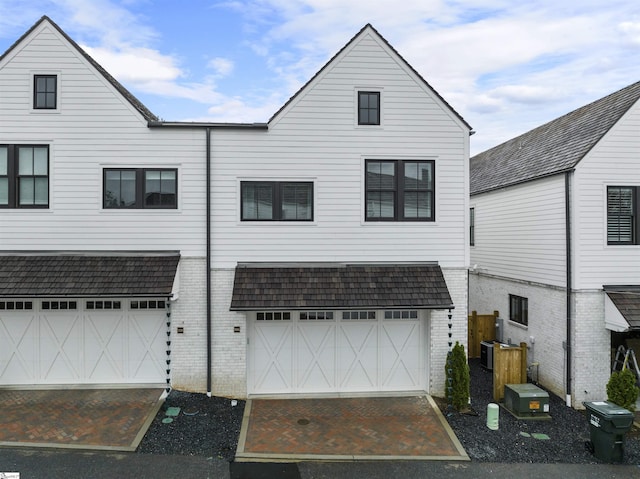 back of house with a garage