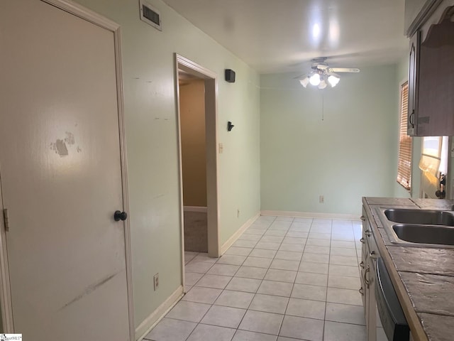 kitchen with sink, dishwasher, ceiling fan, and light tile floors