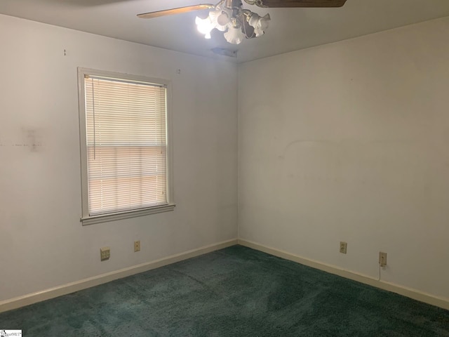 unfurnished room with a healthy amount of sunlight, ceiling fan, and carpet