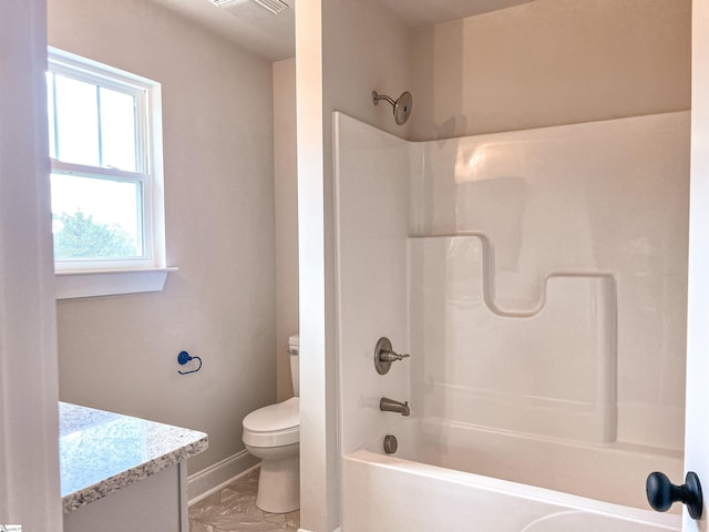 full bathroom with plenty of natural light, vanity, bathtub / shower combination, and toilet