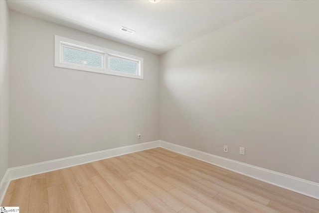 spare room with light hardwood / wood-style floors