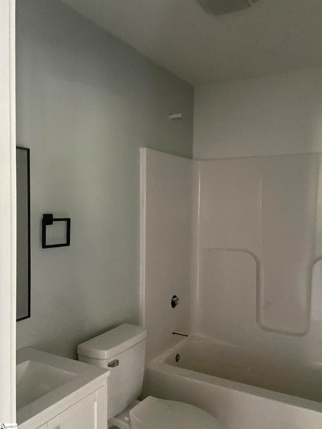 full bathroom with shower / bathing tub combination, vanity, and toilet