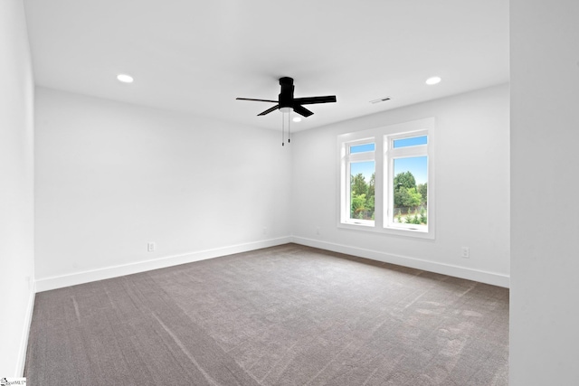 unfurnished room featuring carpet floors and ceiling fan