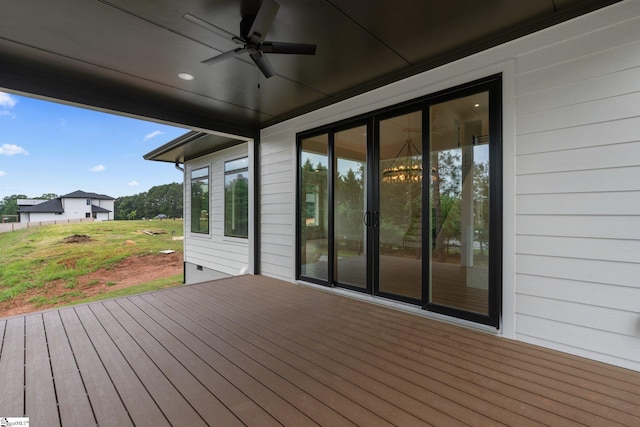 wooden terrace featuring ceiling fan