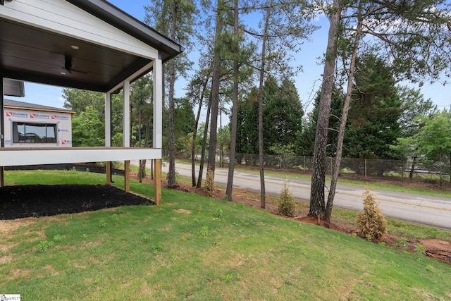 view of yard with ceiling fan