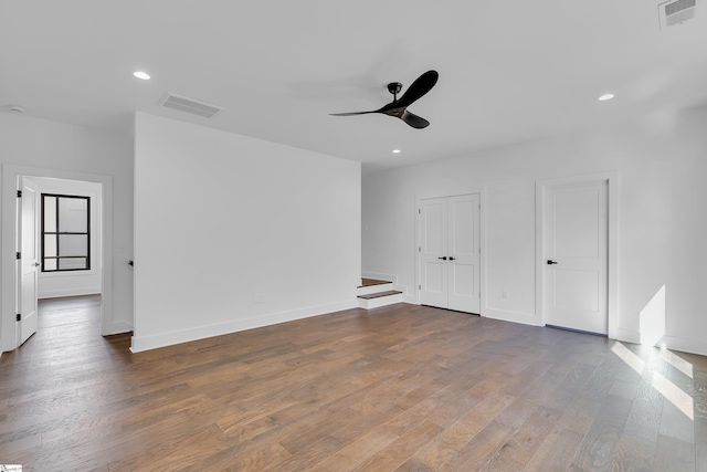 unfurnished bedroom featuring recessed lighting, wood finished floors, and visible vents