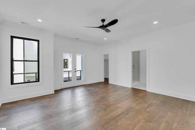 empty room featuring baseboards, ornamental molding, recessed lighting, french doors, and dark wood-style floors