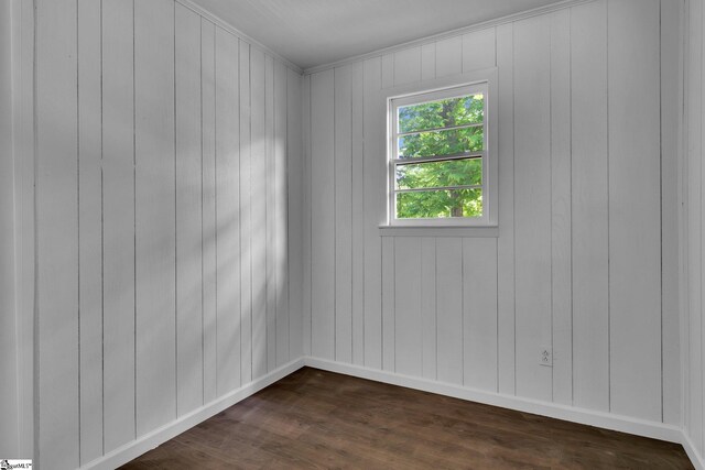 spare room featuring dark hardwood / wood-style flooring