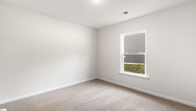 unfurnished room featuring carpet flooring