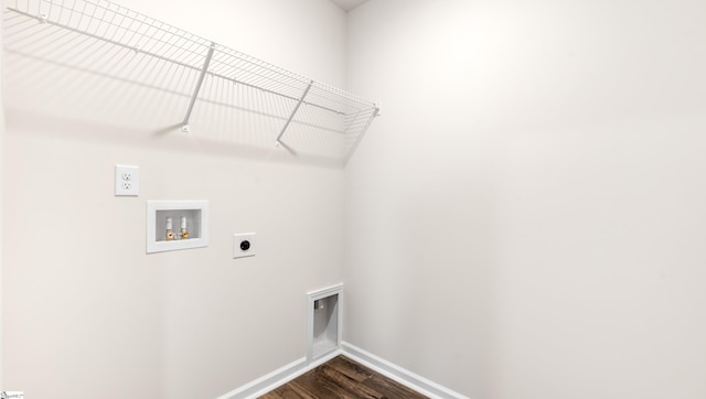 laundry room featuring electric dryer hookup, hookup for a washing machine, and dark hardwood / wood-style flooring