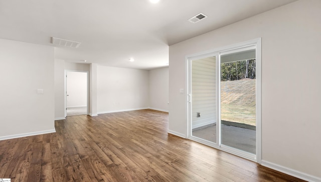 empty room with wood-type flooring