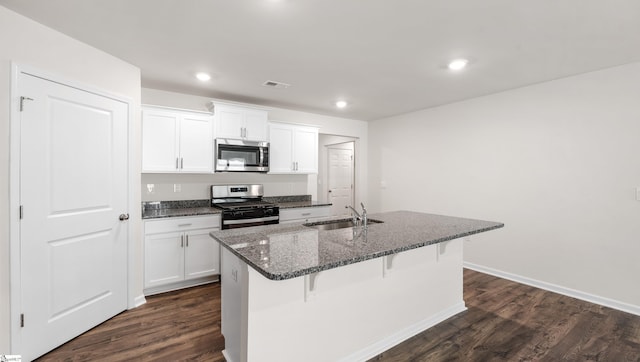 kitchen with a kitchen island with sink, sink, white cabinets, and stainless steel appliances