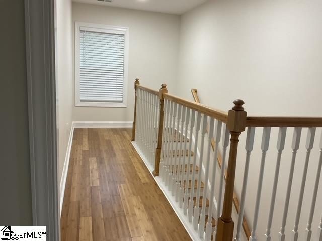 corridor featuring hardwood / wood-style flooring