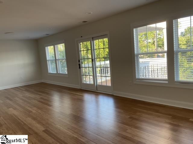 spare room featuring hardwood / wood-style flooring