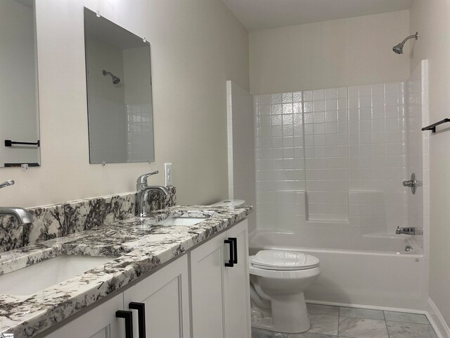 full bathroom with toilet, tile flooring, double vanity, and  shower combination