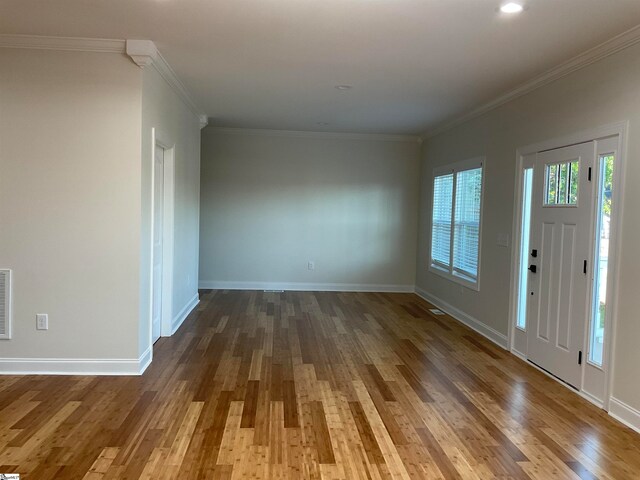 entryway with hardwood / wood-style flooring and ornamental molding