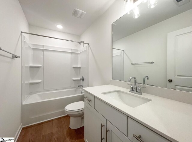 full bathroom with vanity, bathing tub / shower combination, and toilet