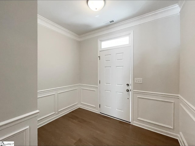 foyer entrance with wainscoting, dark wood-style floors, visible vents, and ornamental molding