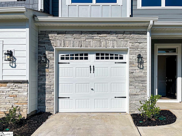 garage with concrete driveway